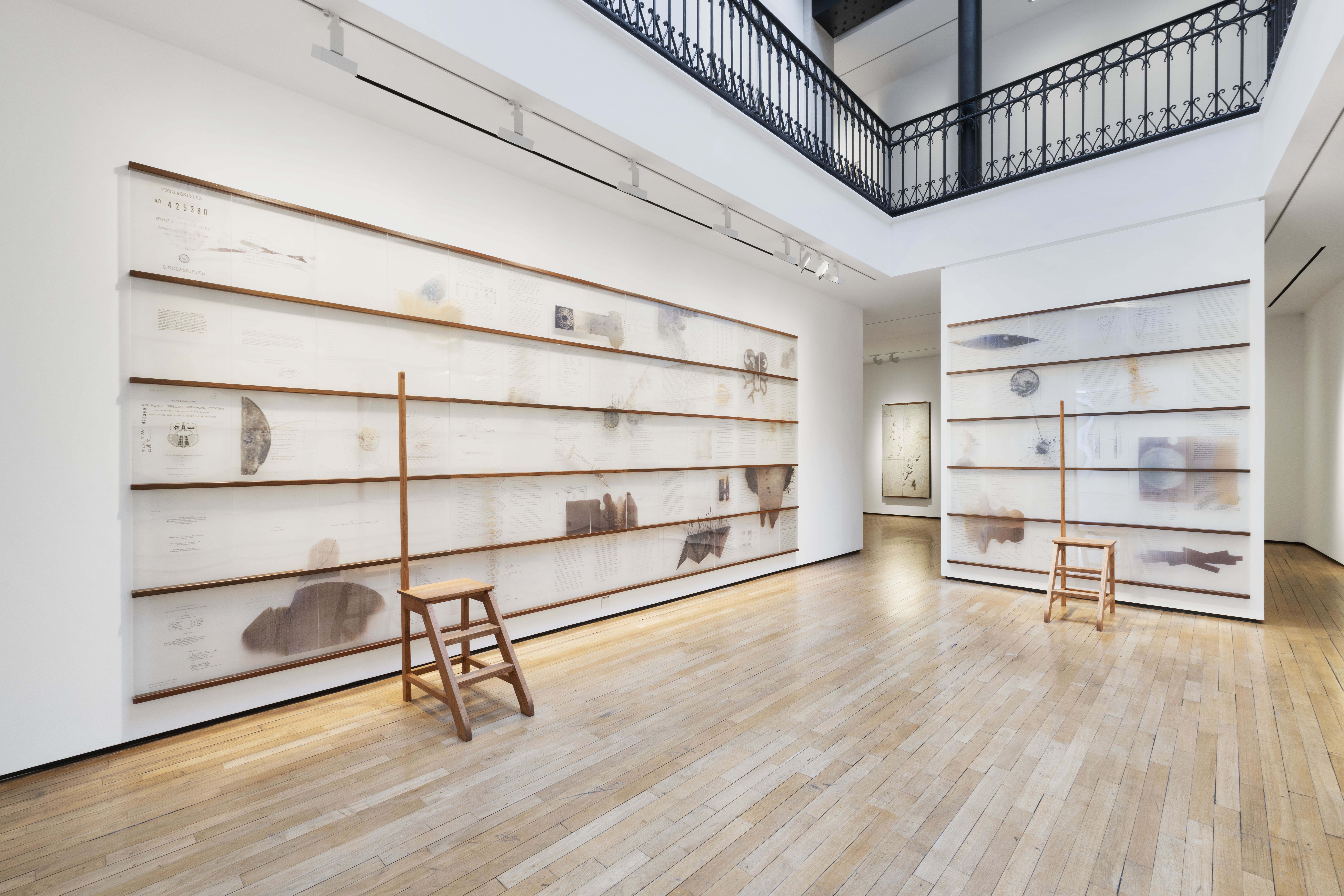 Exhibition view of Point of Incidence by Jitish Kallat. The artwork Lunar Redux covers all three walls of the room.